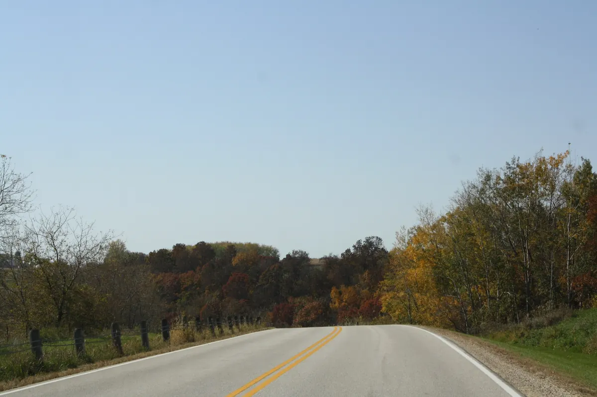 Apple Blossom Drive running between fields and autumn trees above the Mississippi valley in Minnesota