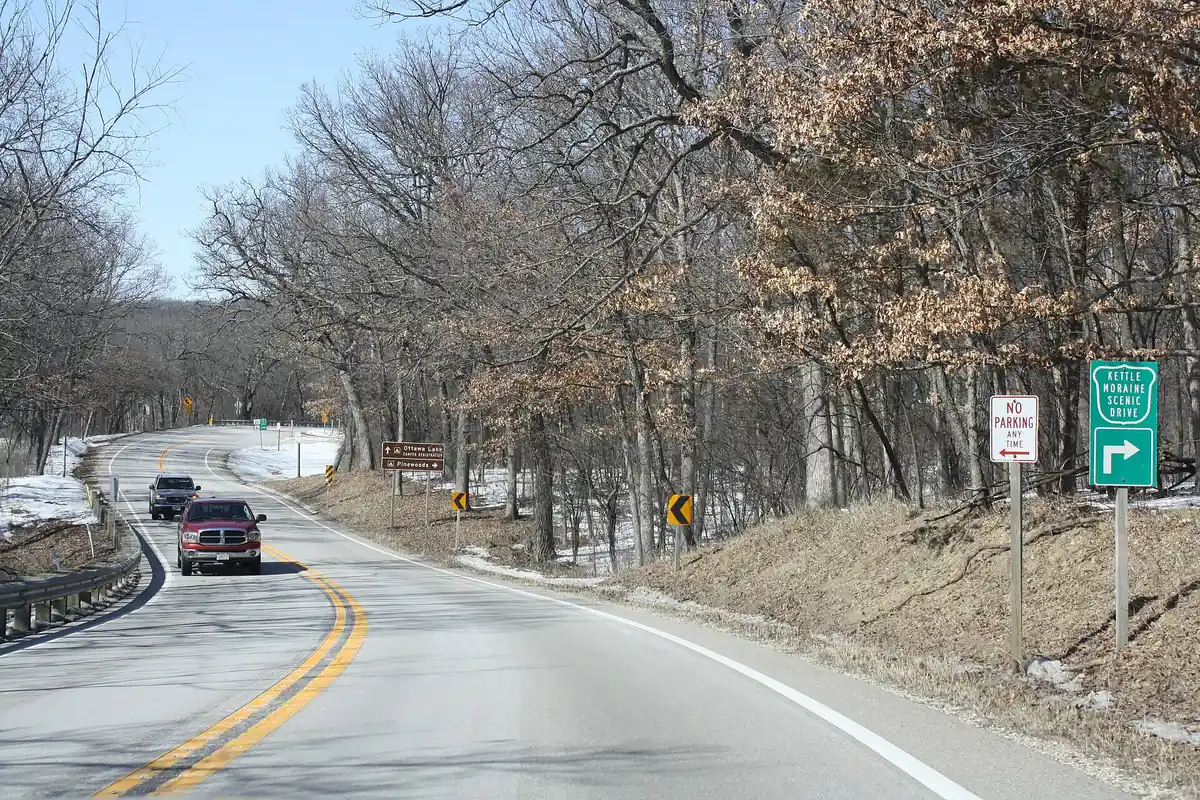 Two-lane Kettle Moraine Scenic Drive curving through oak woods in the Southern Unit of Kettle Moraine State Forest