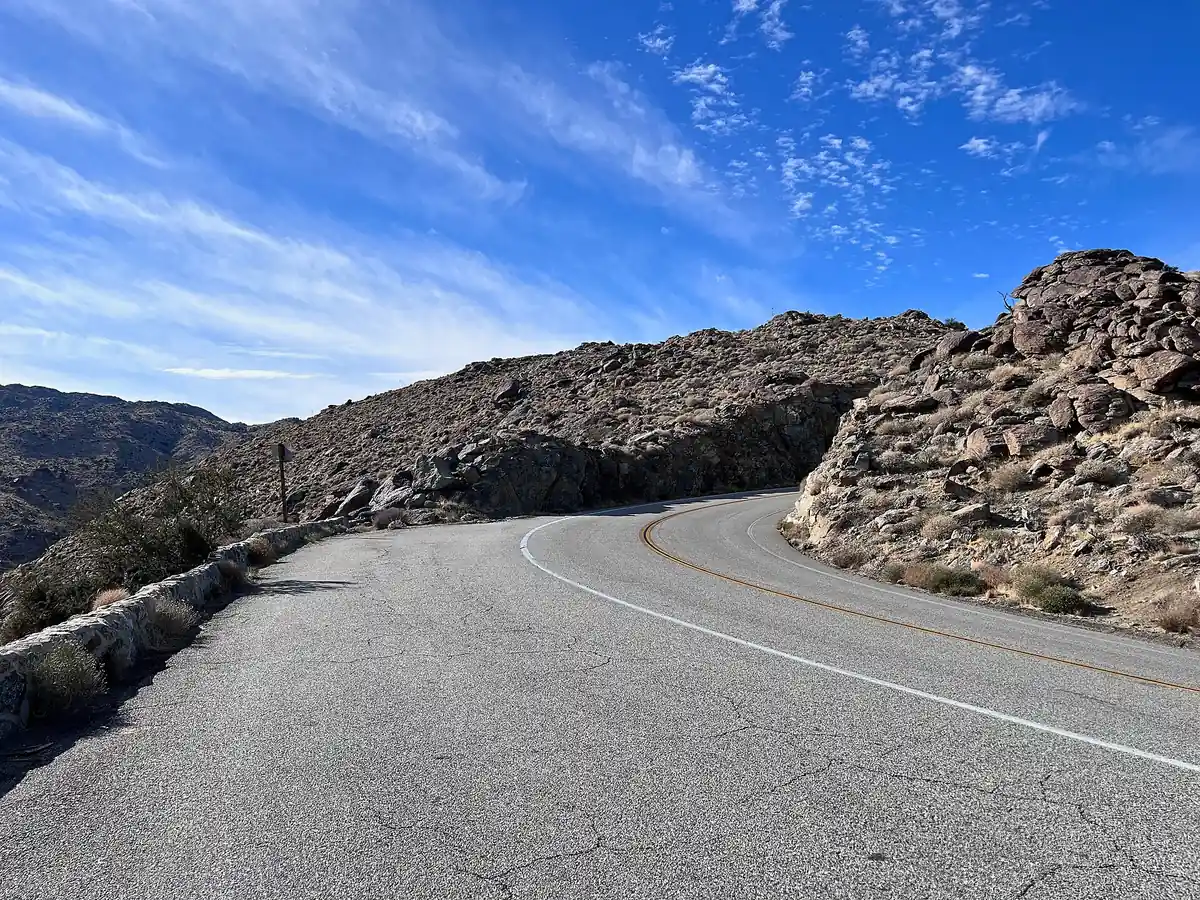 A curve of Montezuma Valley Road with a low stone wall on the Montezuma Grade above Borrego Valley