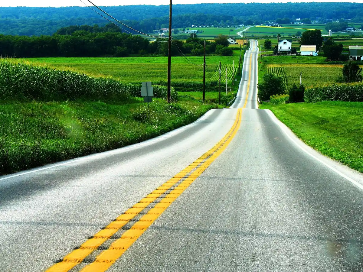 PA 897 running over rolling green Amish farmland in Lancaster County