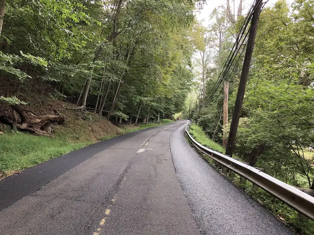PA 32 River Road bending through woods along the Delaware near Point Pleasant, Bucks County