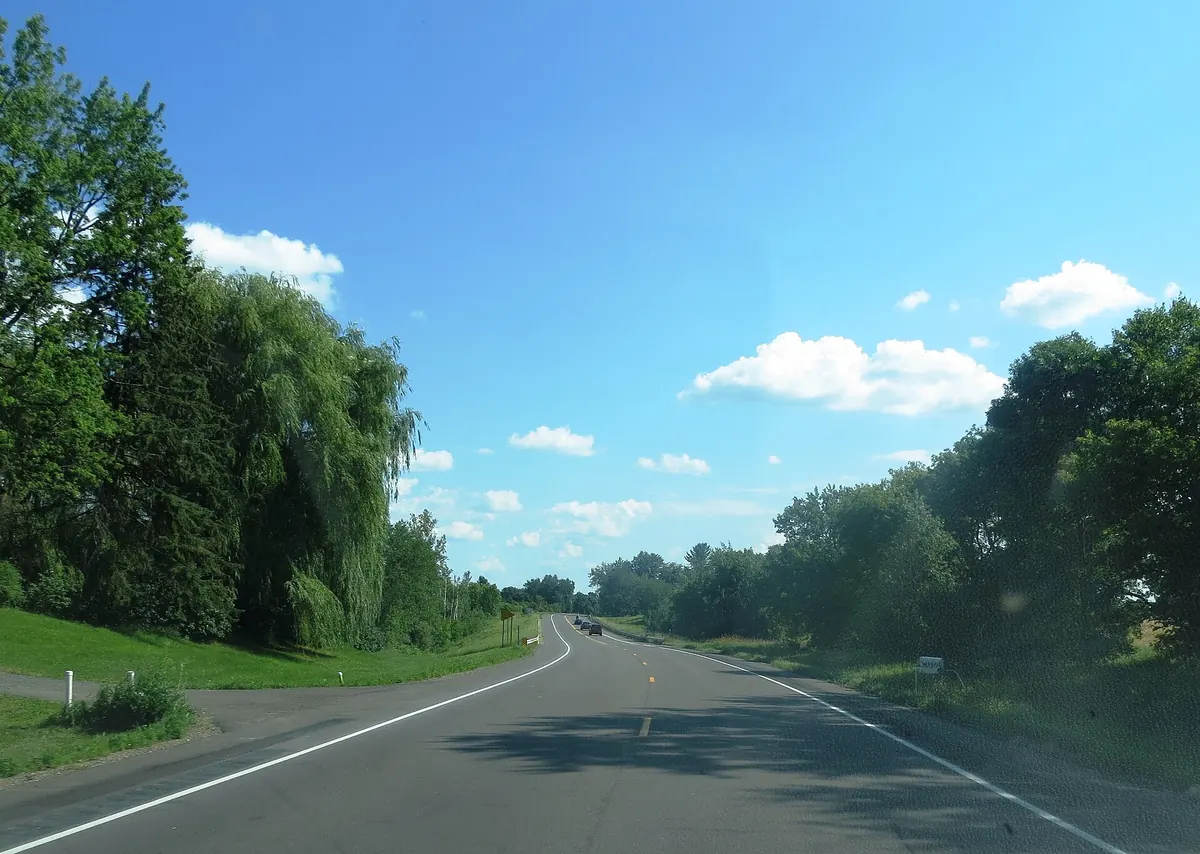 Minnesota Highway 95, the St. Croix Trail, running through summer trees in Chisago County