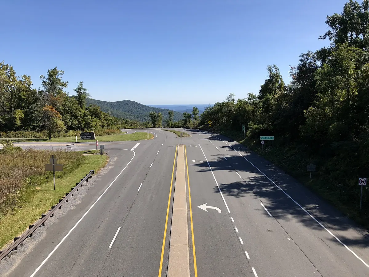 US 211 heading east from Thornton Gap in Shenandoah National Park, with forested Blue Ridge slopes beyond